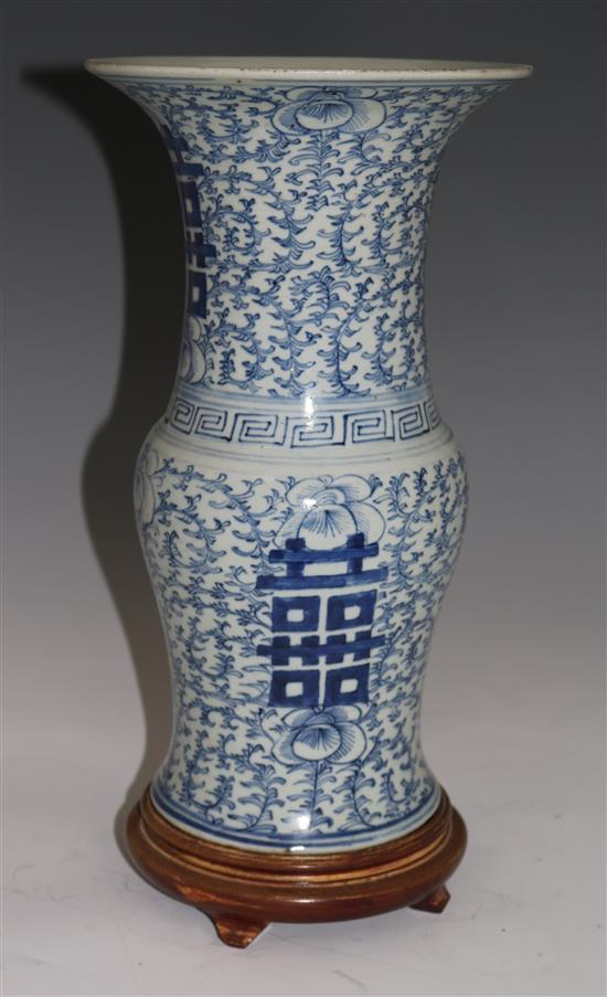 A Chinese blue and white sweet pea beaker vase, 19th century, 37cms, with hardwood stand